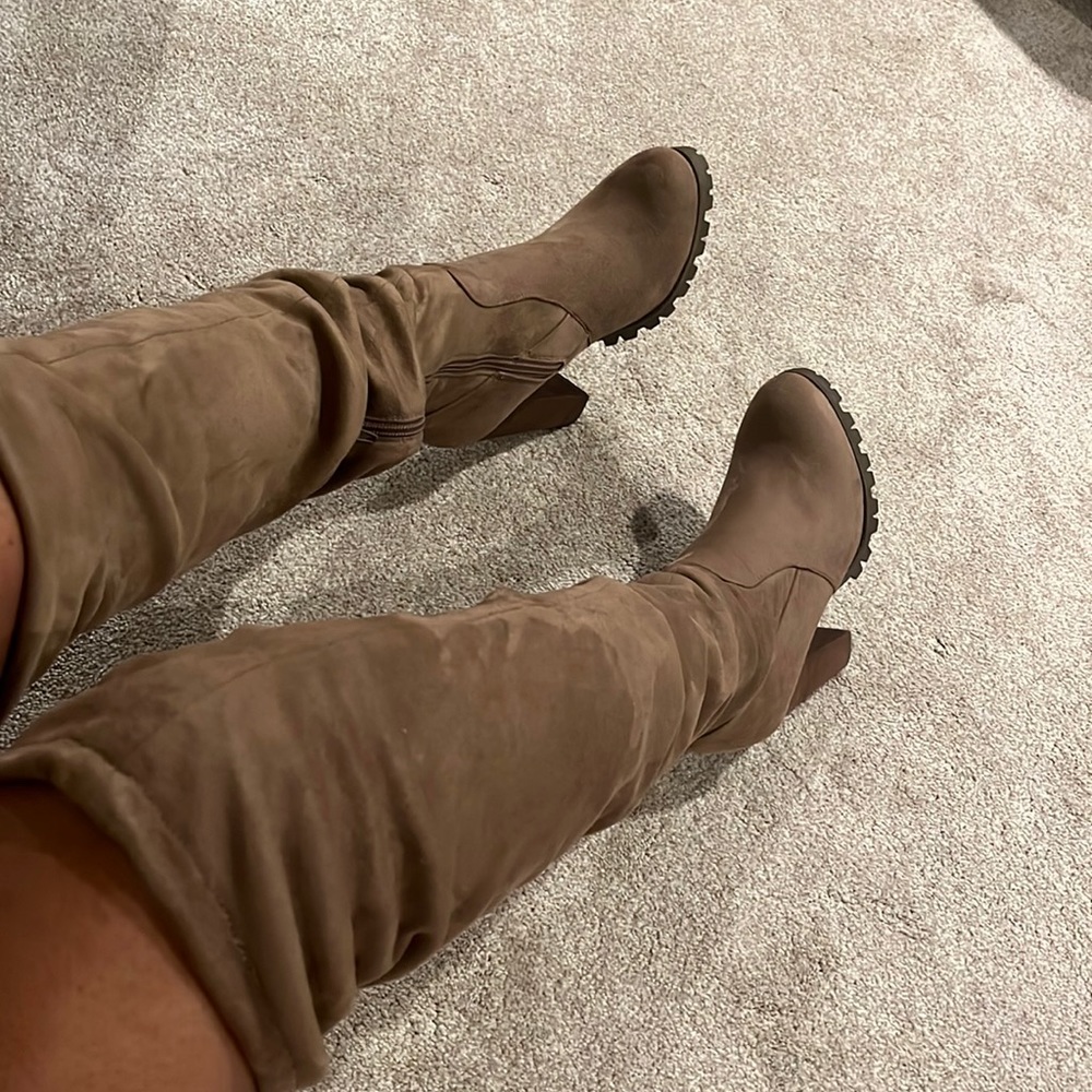 Suede thigh high lug sole boots.